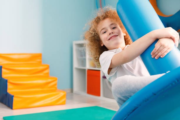 Child engaging in autism occupational therapy activities for sensory development
