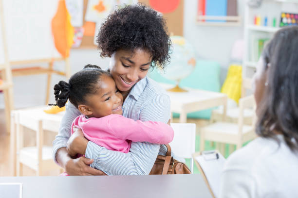 Childcare professionals providing a comforting environment for kids, highlighting Strategies for Separation Anxiety